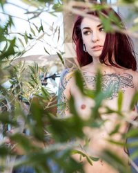 Рыжая красотка с татуированным телом показала стриптиз 13 фотография Рыжая красотка с татуированным телом показала стриптиз 13 фотография